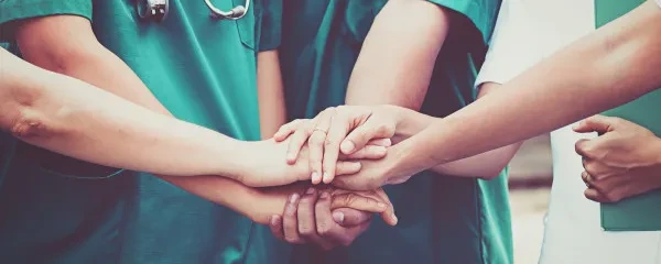 medics touching hands