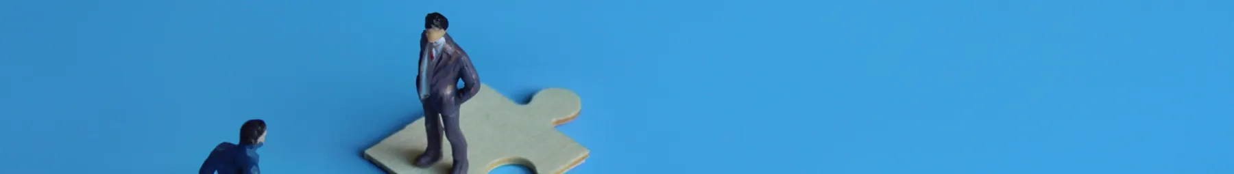 two people on jigsaw pieces