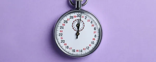 stopwatch lilac background