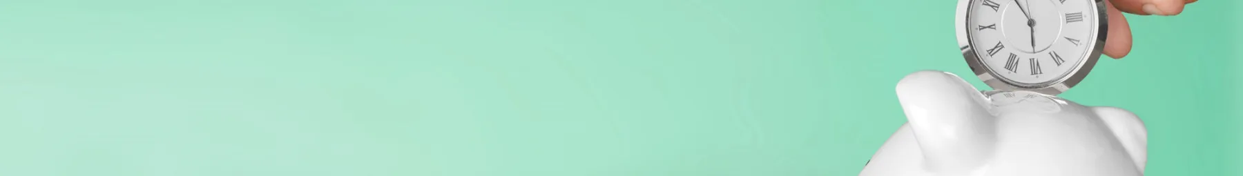 Clock at the top of a piggy money box