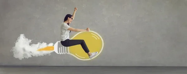 woman flying on lightbulb