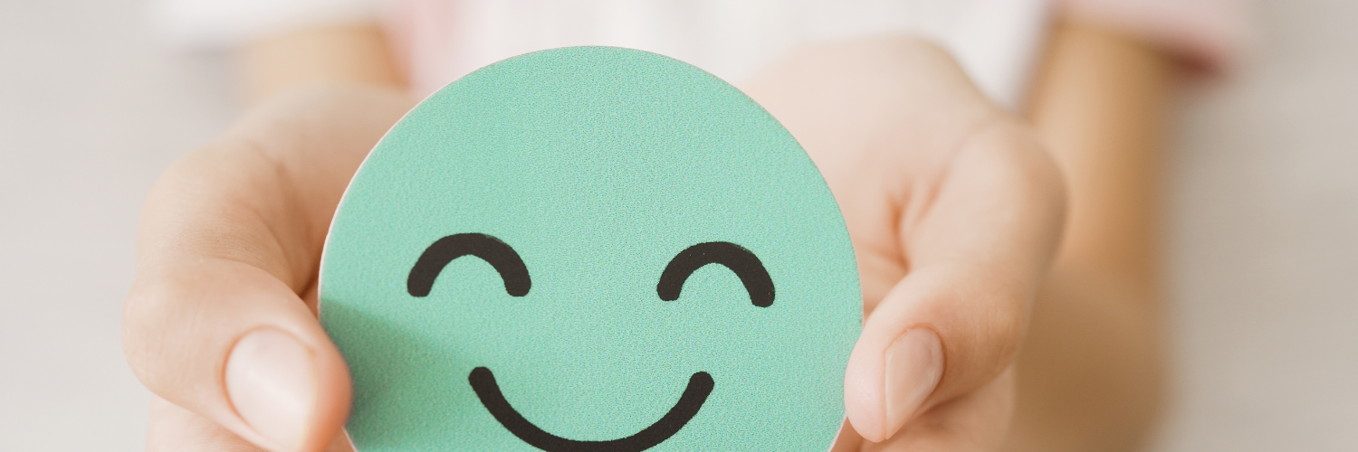 Hands Holding Smiley Face